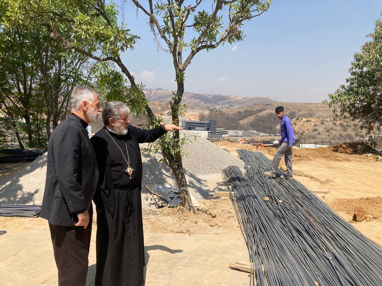 Fr. Martin w His Eminence IGNACIO visiting the parking garage project.