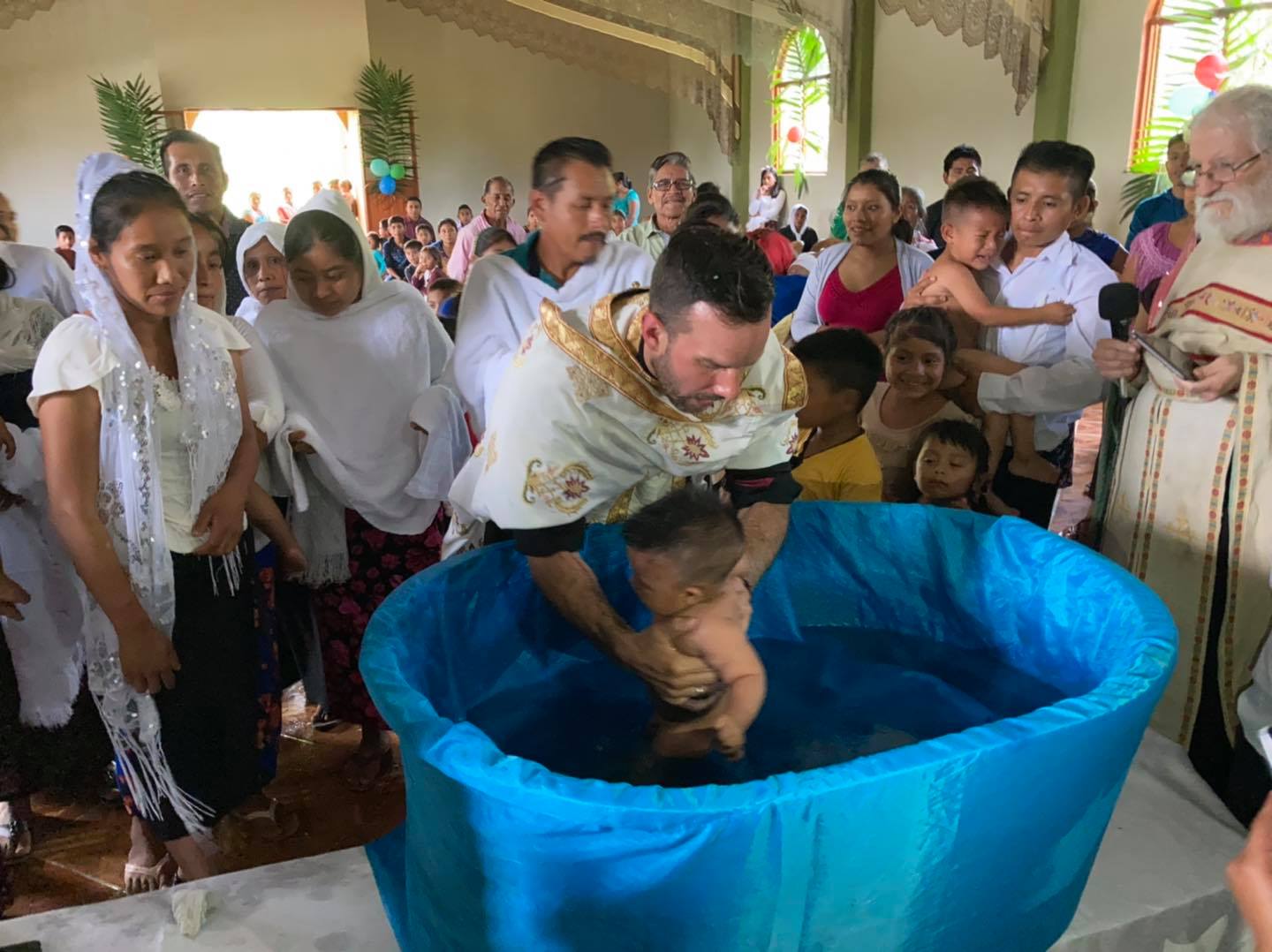 Fr. Thomas Manuel performing a baptism in Mexico