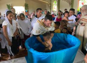 Fr. Thomas Manuel performing a baptism in Mexico
